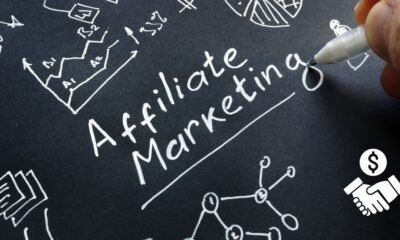 Man is writing Affiliate marketing on a black surface. (high ticket affiliate marketing)