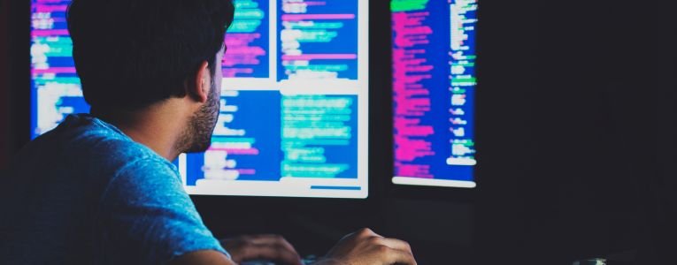 Adult student working on complex algorithms at his desktop pc