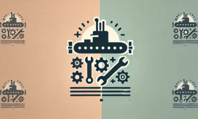 Wide-format image with a clean, modern design featuring a soft gradient background that blends light peach to mint green. In the center, a minimalistic icon represents the Frank Cable Machine Shop, showing repair tools like wrenches and gears alongside a submarine silhouette, outlined in medium navy blue with warm amber accents. A subtle gray shadow beneath the icon adds depth, enhancing clarity and simplicity.