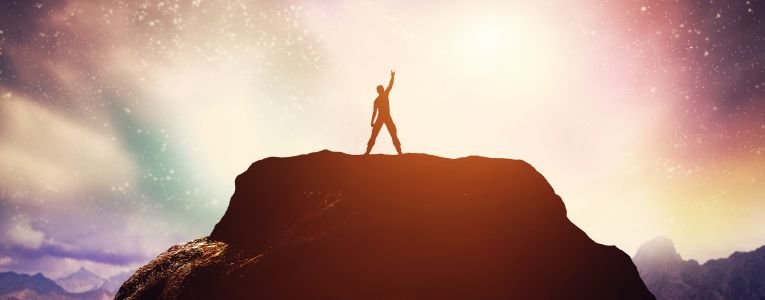 Man Standing on a Mountain